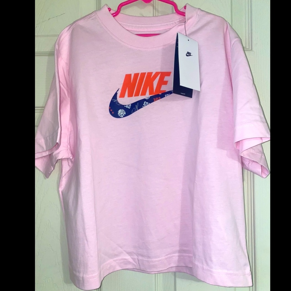 Light pink Nike T-shirt.